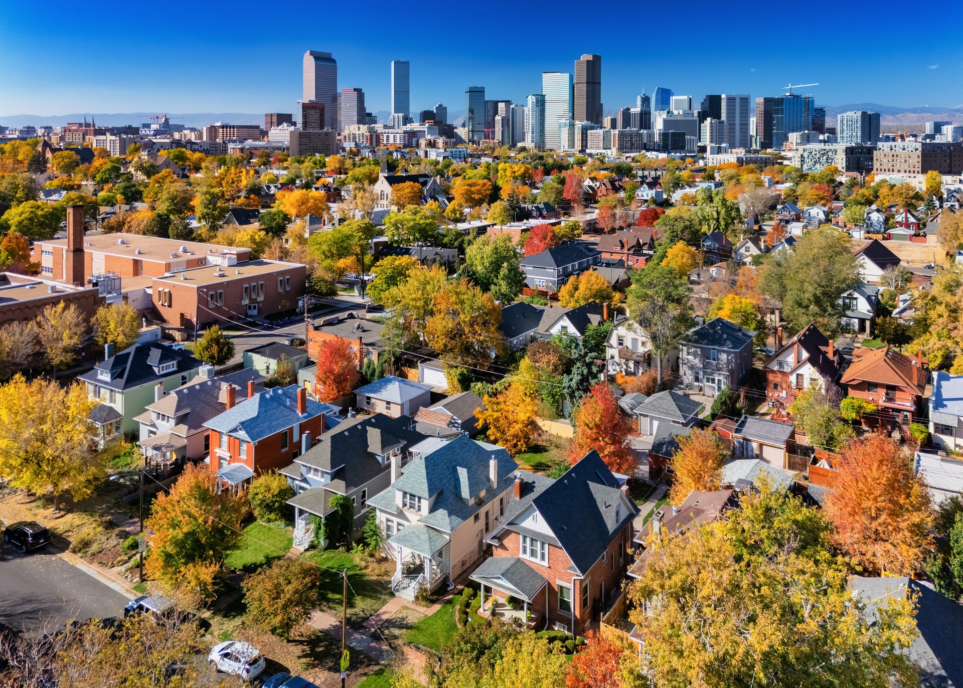 Denver Neighborhood Aerial In Autumn With Vibrant Colors And Skyline